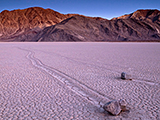 Picture of tracks left by moving rocks on the dried flat mud at the Racetrack Playa, Death Valley National Park, California