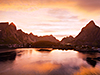 Picture of the midnight sun over the Lofoten Islands, Norway.