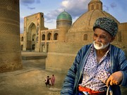 Photo: A man in front of a mosque