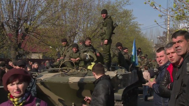 People surround Ukrainian military vehicle