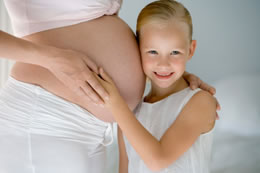 Image of a pregnant woman and child