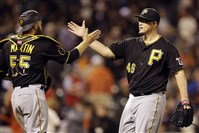  Pirates pitcher Vance Worley celebrates with catcher Russell Martin after the 5-0 defeat of San Francisco.