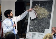  Dan Bitt, a CONSOL Energy representative shows Findlay Twp. residents a map of proposed drilling sites  around Pittsburgh  International Airport.