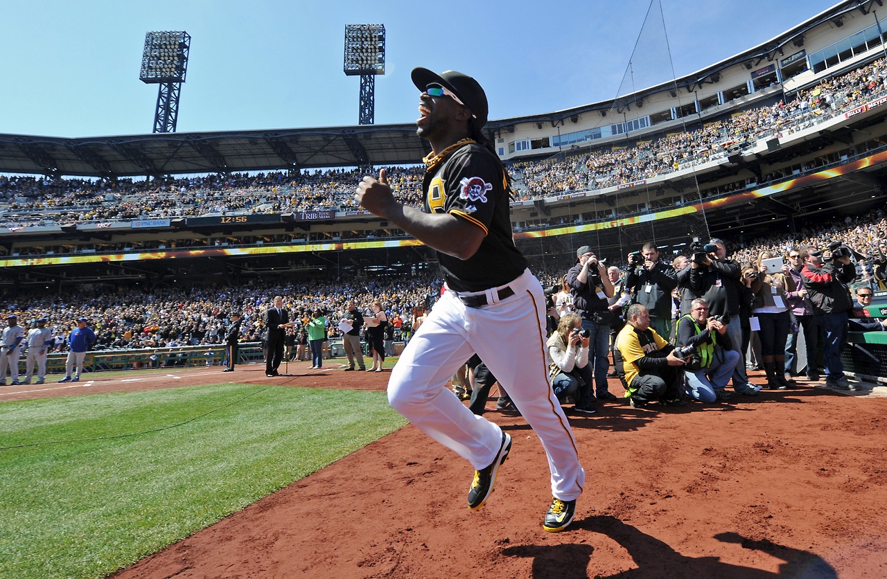 Pirates&#8217; Andrew McCutchen runs onto the field after being introduced during the opening day game against the Chicago Cubs at PNC Park on Monday, March 31, 2014. 
&#8212;Matt Freed/Post-Gazette