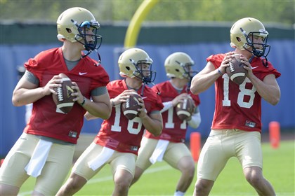 20140804radPittPracticeSpts06-5 Pitt quarterbacks Adam Bertke, Chad Vojtik, Trey Anderson and Joe Repischak during passing drills on the first day of preseason football practice Monday at their training facility on the South Side. 