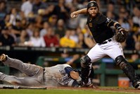  Pirates' Russell Martin turns a double play as he gets Padres' Evereth Cabrera out at home plate in the sixth inning at PNC Park Friday night. 