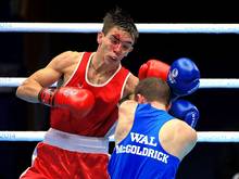 Belfast’s Michael Conlan bravely fights on despite suffering a painful cut to his face against Wales’ Sean McGoldrick in their bantamweight semi-final in Glasgow