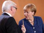 Foreign Minister Frank-Walter Steinmeier (SPD) (L) and German Chancellor Angela Merkel (CDU) arrive for the weekly German federal Cabinet meeting on July 9, 2014 in Berlin, Germany. High on the meeting's agenda was discussion over the European Union Banking Union, a series of instruments intended to stabilize the EU's banking sector.