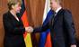 Russian President Vladimir Putin shakes hand with German chancellor Angela Merkel, during a meeting last month