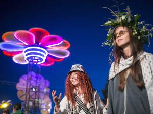 15 August 2014: Costumed fans listen to the performance of Paris based Lebanese singer Yasmine Hamdan at the 22nd Sziget (Island) Festival on the Shipyard Island in northern Budapest, Hungary