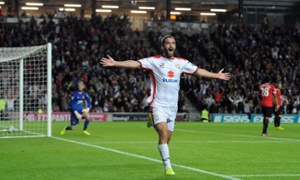 Manchester United humbled by MK Dons after Will Grigg hits double