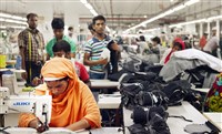  Garment workers at the Nishat Complex, a Ha-Meem Group factory, sew pockets for blue jeans in early July. Ha-Meem Group is one of the largest apparel makers in Bangladesh and owns That's It Sportswear and Next Collections. 