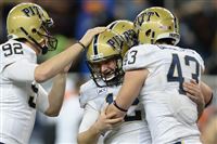 Pitt's Chris Blewitt is congratulated after kicking the go-ahead field goal against Bowling Green in the fourth quarter in the Little Caesars Pizza Bowl at Ford Field in Detroit on Thursday, December 26, 2013.