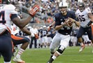  Penn State quarterback Christian Hackenberg scores on a 9-yard run in the second quarter of an NCAA college football game against Illinois in State College, Pa., Saturday, Nov. 2, 2013.