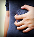 woman clutching at stomach