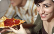 Woman eating pizza 