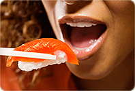 woman eating sushi