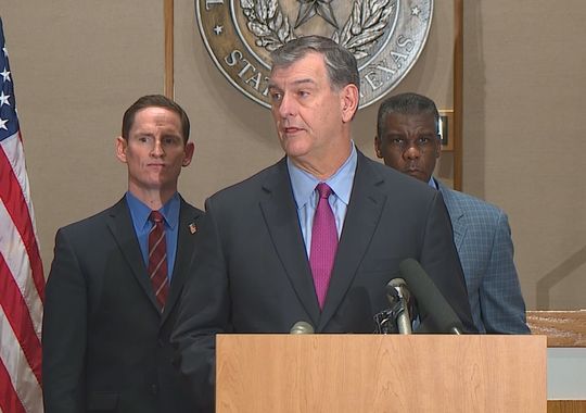 Dallas Mayor Mike Rawlings speaks at a news conference.