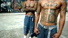 Members of the Mara 18 gang show their tattoos in the National Penitentiary in Tamara, near the Honduran capital, Tegucigalpa. Photograph: Elmer  Martinez/AFP/Getty Images
