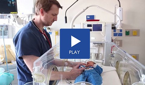 Video preview of a neonatal nurse taking the temperature of an infant in a hospital room.