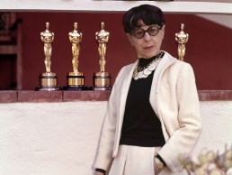  Posing with her eight Academy Award statuettes, Edith Head still holds a record in the Costume Design category.