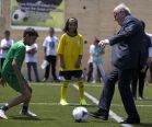 FIFA President Sepp Blatter kicks a ball 