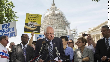 U.S. Senate Budget Committee ranking member Senator Bernie Sanders, center, I-Vermont, speaks during a news conference to discuss legislation to restore pension guarantees for thousands of retired union workers, in front of the US Capitol in Washington, D.C., June 18, 2015. 