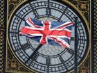 The Union Flag flutters in front of the Big Ben clock tower on the Houses of Parliament in London