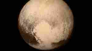 An image of Pluto that was taken by New Horizons shortly before its flyby Tuesday shows a heart-shaped pattern on the planet's surface. NASA says Pluto "sent a love note back to Earth."