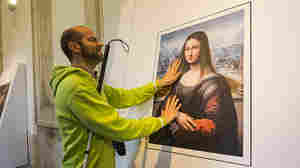 A blind visitor to Spain's Prado Museum runs his fingers across a 3-D copy of the Mona Lisa, painted by an apprentice to Leonardo da Vinci.
