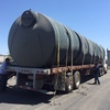 Five 2,500-gallon water tanks wait to be unloaded at the nonprofit Self-Help Enterprises near Visalia, Calif. So far about 140 tanks have been distributed to homes, but at least 1,000 more are needed in Tulare County alone.