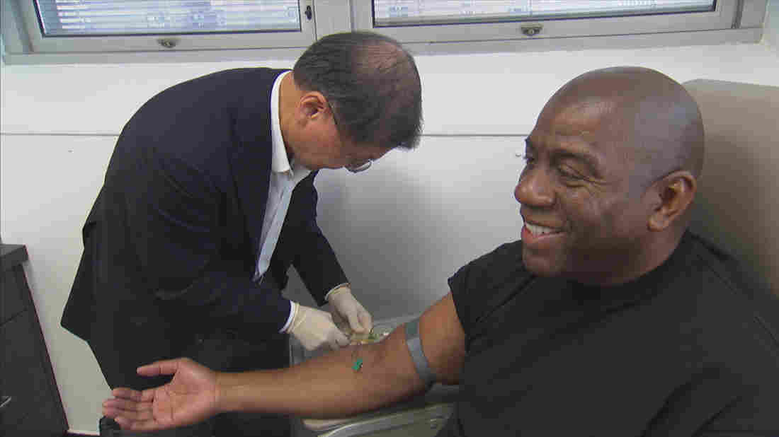 Dr. David Ho, an HIV/AIDS specialist, draws blood from Magic Johnson, one of the people featured in Endgame: AIDS in Black America.