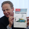 Georg Kapsch, President of the Federation of Austrian Industry, holds an issue of The Economist during a news conference in Vienna last year. Britain's Pearson PLC says it's in talks to sell its 50 percent share in The Economist Group.
