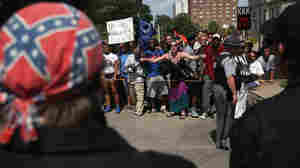 Protesters shout at Ku Klux Klan members at a Klan demonstration at the Statehouse on Saturday in Columbia, S.C.