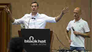 Chris Valasek (left) and Charlie Miller talk about hacking into vehicle computer systems during the Black Hat USA 2014 hacker conference in Las Vegas last August.