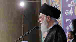 Iran's Supreme Leader Ayatollah Ali Khamenei delivers a sermon during morning prayers for the Eid al-Fitr holiday, marking the end of the holy month of Ramadan. He signaled his approval of the nuclear agreement with Western powers but reiterated that Tehran's policy toward the "arrogant" United States would not change.