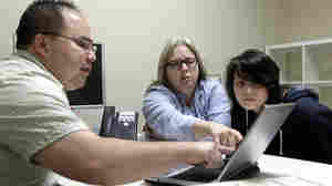 Enrollment counselor Vue Yang (left) reviews health insurance options for Laura San Nicolas (center), accompanied by her daughter, Geena, 17, at Sacramento Covered in Sacramento, Calif., in February.