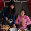 Meihua and her parents shared a room at a temporary school following the earthquake. She's shown here with her mother in 2009, a year after the quake.