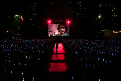 Tim Curry on screen in “The Rocky Horror Picture Show” and a sea of headphones at Damrosch Park at Lincoln Center on Friday night.