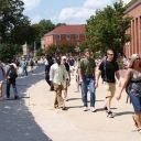 Students rush to class at the University of Mississippi, Sept. 1, 2010, in Oxford, Miss. Fiscal cuts from state funding are expected to affect all of the state's eight public colleges and may force faculty and staff layoffs, program eliminations and cuts in classes and services offered to students as well as raise various fees at the schools while they try to lessen the loss of funds.  (AP Photo/Rogelio V. Solis)