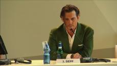 Depp talks pet dogs at Venice press conference