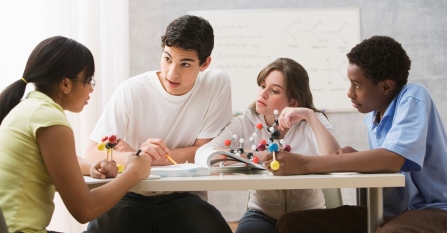teens talking around a table