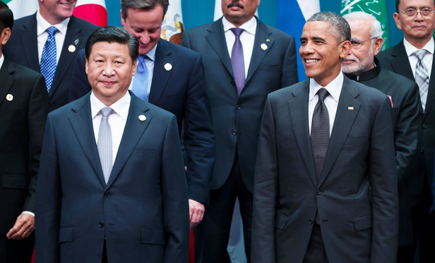 Chinese President Xi Jinping and U.S. President Barack Obama at a G-20 summit in Brisbane, Australia last November. They will meet again next month in Washington, D.C. for Xi's first state visit where China's hunt for economic fugitives in the U.S. is expected to be discussed. 