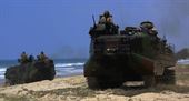 Marines with Company A, 3d Assault Amphibian Battalion, 1st Marine Division, maneuver their Amphibious Assault Vehicle to the shore aboard Marine Corps Base Camp Pendleton, Calif., after exiting the well deck of amphibious transport dock ship USS New Orleans (LPD18), during a training exercise, Aug. 22, 2015. The purpose of the training was to provide surf qualification training for the battalion’s crew members. 