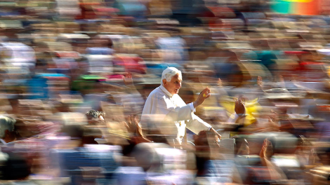 Pope Benedict XVI waves as he arrives to lead his weekly audience in Saint Peter's Square at the Vatican October 12, 2011. 