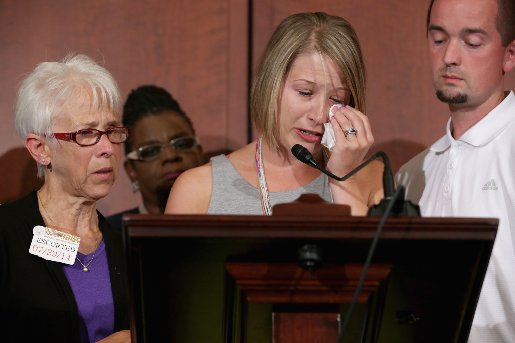 The mother, sister and brother-in-law of Lori Jackson, who was shot to death a year ago after seeking a restraining order against her estranged husband. (Chip Somodevilla/Getty Images)