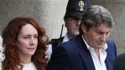 Former News of the World editor Andy Coulson was convicted Tuesday of phone hacking while Rebekah Brooks, his colleague, was cleared of all charges.
