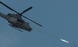 A UH-1Y helicopter fires the Advanced Precision Kill Weapon System (U.S. Navy photo)