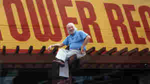 On top of the world: Tower Records founder Russ Solomon above his Sacramento, Calif., store in 1989.