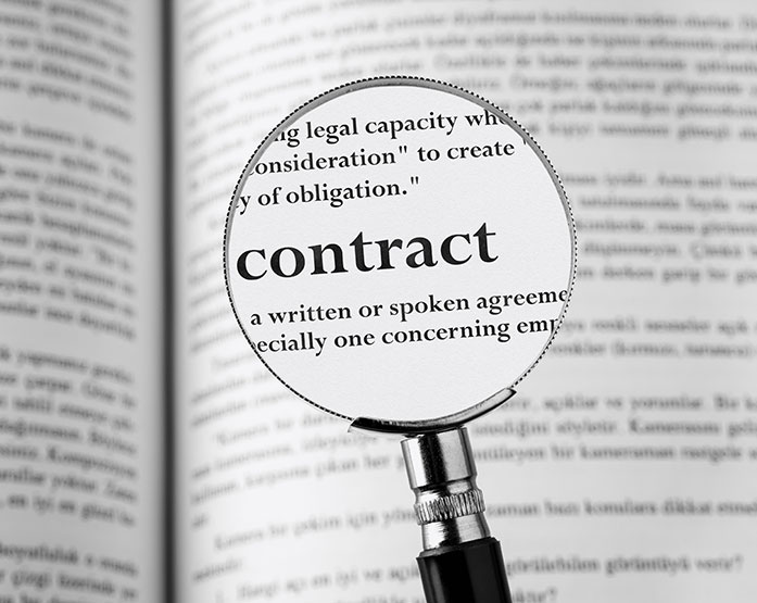magnifying glass over the word contract